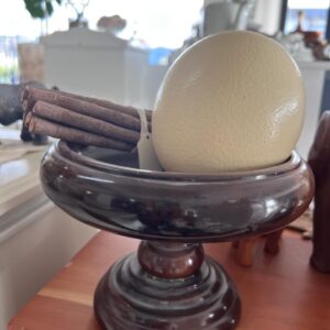 21. Wooden bowl with ostrich egg and wooden pencils